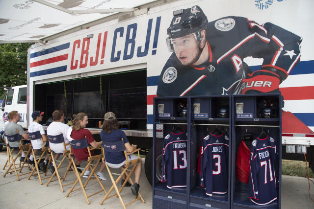 Students play video games at the Columbus Blue Jackets Truck.